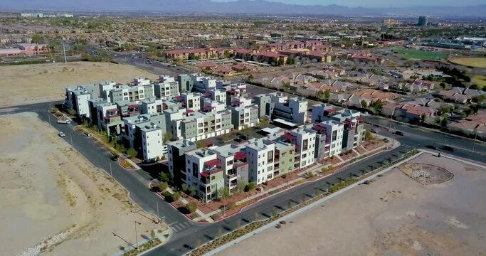 Aerial view, pan around Apartment Complex, neighborhood with Las Vegas Strip in distance