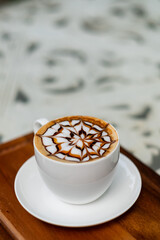 hot latte art coffee on wood table, relax time