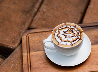 hot latte art coffee on wood table, relax time