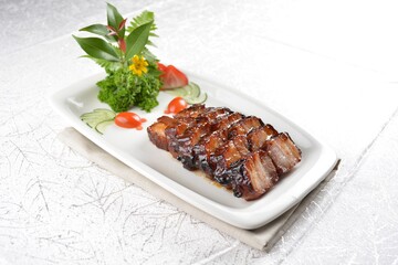 Hong Kong Roasted bbq dark honey sweet pork belly meat char siew in white background asian banquet menu