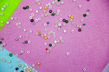 multicolored beads, beads for needlework, background with beads, close-up, scattered beads