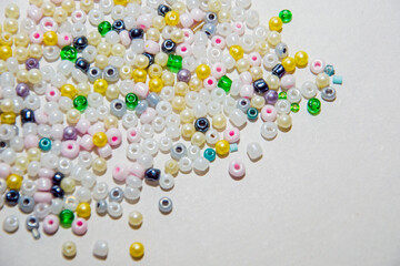 multicolored beads, beads for needlework, background with beads, close-up, scattered beads