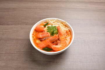 braised cook big fresh tiger prawn with red spicy curry soup in wood background asian halal menu