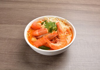 braised cook big fresh tiger prawn with red spicy curry soup in wood background asian halal menu