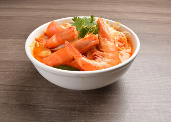 braised cook big fresh tiger prawn with red spicy curry soup in wood background asian halal menu