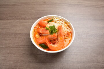 braised cook big fresh tiger prawn with red spicy curry soup in wood background asian halal menu