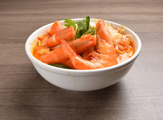 braised cook big fresh tiger prawn with red spicy curry soup in wood background asian halal menu