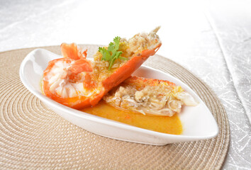 poached big fresh tiger prawn seafood with chinese herb and wine sauce in white background asian halal menu