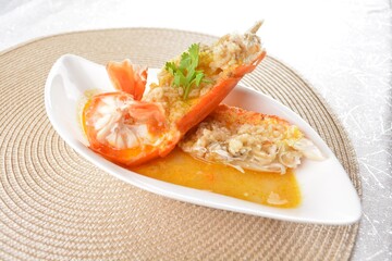 poached big fresh tiger prawn seafood with chinese herb and wine sauce in white background asian halal menu