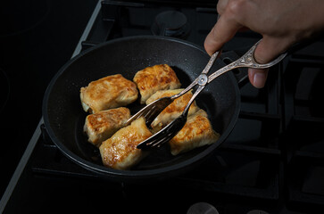 Process of turning and frying the cabbage rolls
