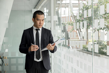 Business people hold a resume for applicants for work interviews about careers and Their personal...