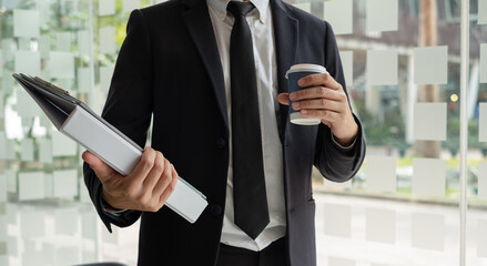 Business people hold a resume for applicants for work interviews about careers and Their personal...