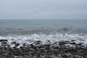 Stormy Black Sea. Pebble beach of Anapa.