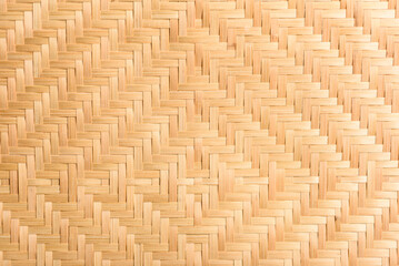 Abstract background of brown woven bamboo, Asian handicrafts, natural materials, products. Sustainability concept.