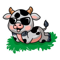Cute baby cow cartoon lying down in grass