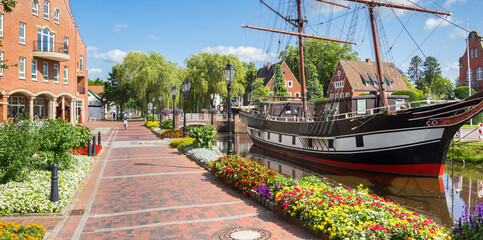 Panorama of flowers in front of the historic ship in Papenburg, Germany