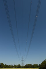 electrical power cables against a blue sky 