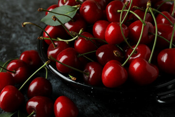 Sweet red cherry berries on dark background