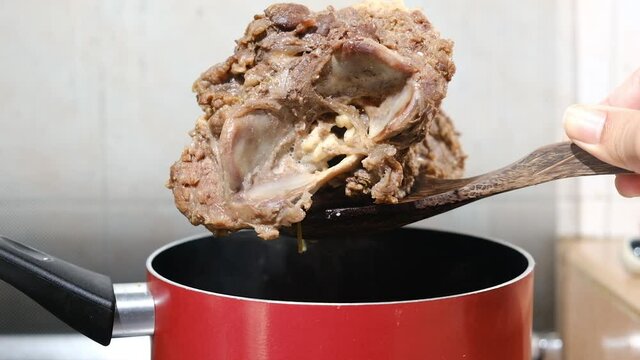 A footage of meat and backbone beef been lifted after boil for making homemade "sup tulang". Famous soup in Nusantara region.