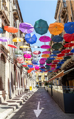 Fototapeta premium Street decorated with colored umbrellas.