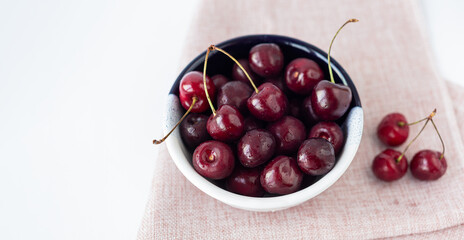 Bowl of ripe cherries. Banner. Selrctive focus. Top view.