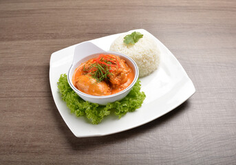 cook braised nonya red curry chicken serve with steamed jasmine white rice main course in wood background asian halal menu