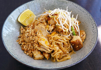 Pad Thai chicken Stir fry rice noodles with tamarind sauce.