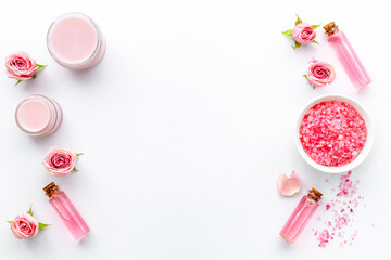 Essential rose aroma oil with cosmetic products for skin care