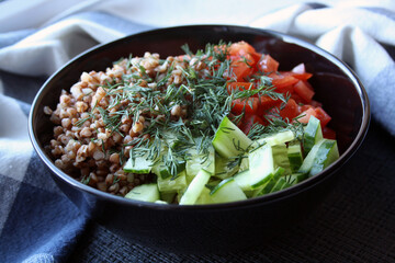 Salad of buckwheat, tomatoes, cucumbers and dill.