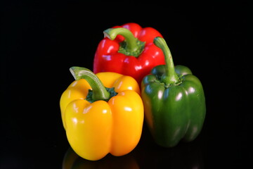 Sweet colorful paprika isolated on dark background