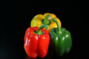 Sweet colorful paprika isolated on dark background