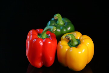 Sweet colorful paprika isolated on dark background