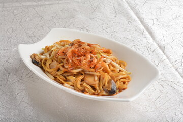 braised ee-fu thick udon noodle with seafood prawn and mushroom in dark soy sauce in white background asian halal menu