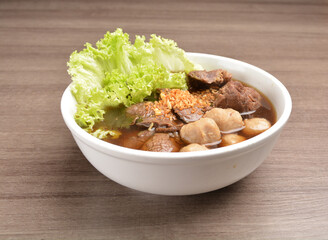 Vietnamese braised beef meat ball hot soup bowl in wood background asian halal menu