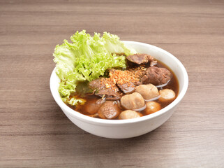 Vietnamese braised beef meat ball hot soup bowl in wood background asian halal menu