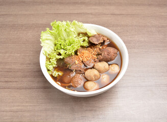 Vietnamese braised beef meat ball hot soup bowl in wood background asian halal menu