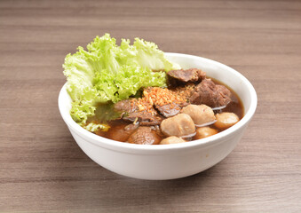 Vietnamese braised beef meat ball hot soup bowl in wood background asian halal menu