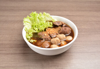 Vietnamese braised beef meat ball hot soup bowl in wood background asian halal menu