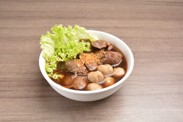 Vietnamese braised beef meat ball hot soup bowl in wood background asian halal menu