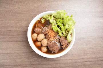 Vietnamese braised beef meat ball hot soup bowl in wood background asian halal menu