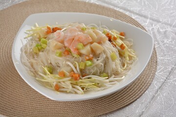 braised wok fried bee hoon vermicelli thin noodle with seafood prawn scallop and vegetables in chef white sauce in white background asian halal menu