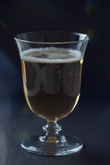 Glass of beer on dark background. Close up.	