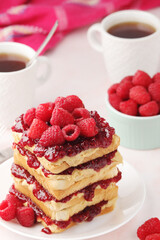 Sandwiches with peanut butter and raspberry jam