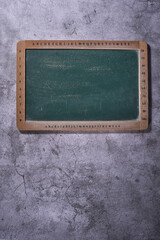 mini blackboard on cement wall