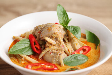 Thai chicken and bamboo shoot curry in ceramic bowl