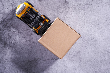 Top view of toy forklift with boxes. Logistics and wholesale concept