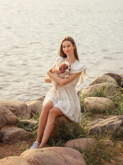 Woman with cavalier king charles spaniel. Girl with dog