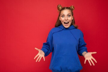 Young happy positive attractive emotional joyful blonde woman with two horns with sincere emotions...