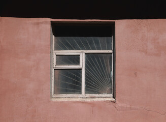 Outdoor shot of an old window. Burred window. No in, no out. Abandoned building. Old dusty window background. Old Wooden frame.