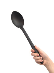 Black plastic ladle in hand, isolated on a white background photo